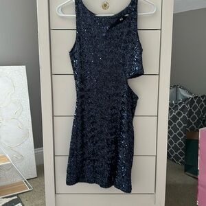 Navy blue sequins bodycon dress with cutouts.